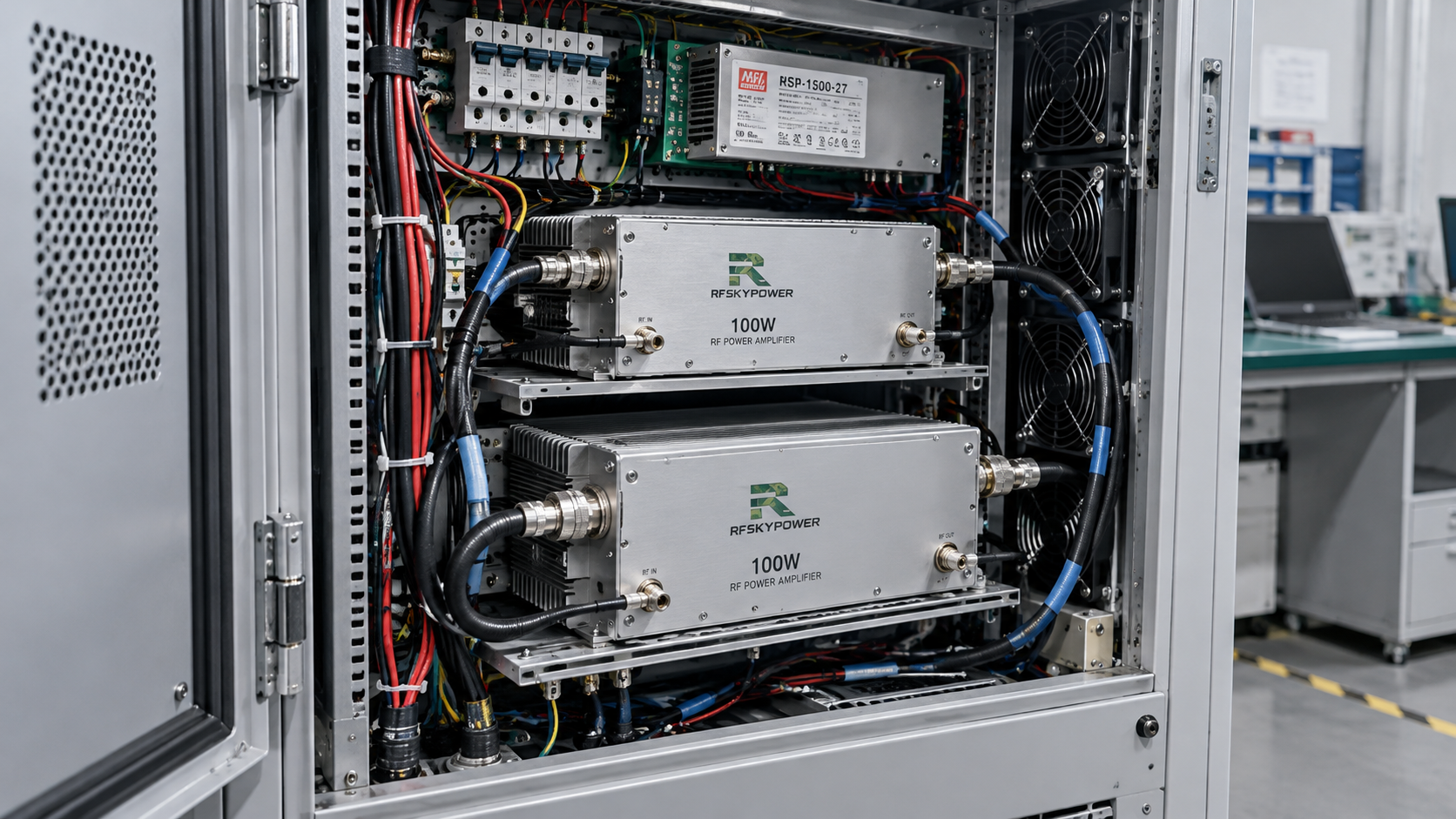Illustrative C-UAS cabinet layout showing two RF power amplifier modules, coaxial cables, DC wiring, cooling fans, and a power supply in a compact enclosure.